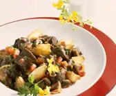 Straussenragout mit Pilzen