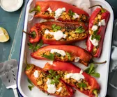 Paprika gefüllt mit Bulgur und Halloumi