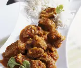 Curry mit Lamm dazu Reis