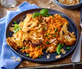 Blumenkohlschnitzel mit cremigem Tomaten-Risotto
