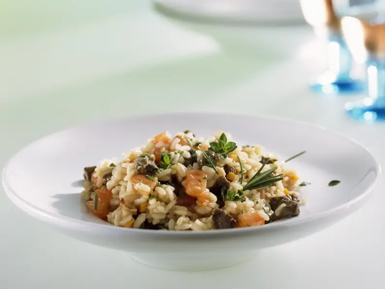 Risotto mit Hirsch und Tomaten
