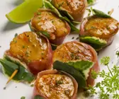 Gegrillte Jakobsmuscheln im Speckmantel