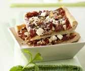 Pizza mit getrockneten Tomaten
