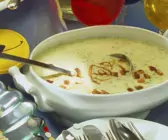 Kressesuppe mit Zwiebelringen und Croutons