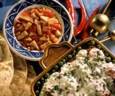 Indische Ofenkartoffeln mit fruchtigem Tomatengemüse