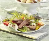 Lauwarmer Salat mit Lammfilet und Papaya