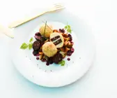 Kartoffel-Blutwurstklöße auf Pfifferlingen