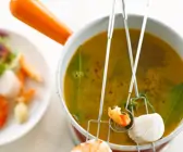 Fondue mit Garnelen und Jakobsmuscheln